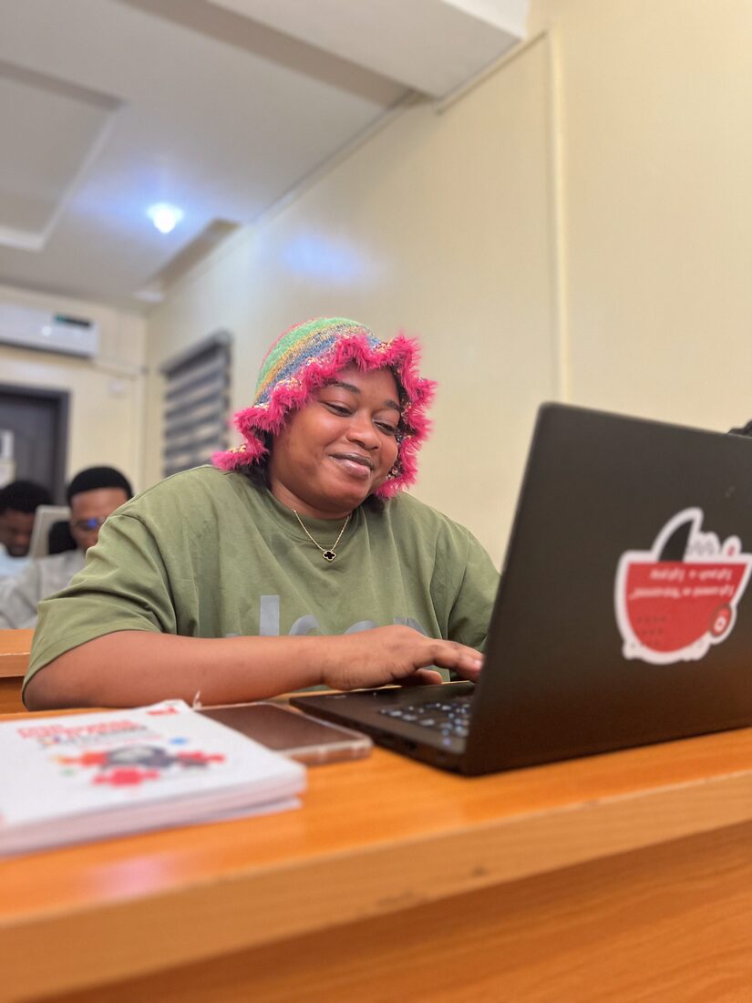 A developer building on her laptop