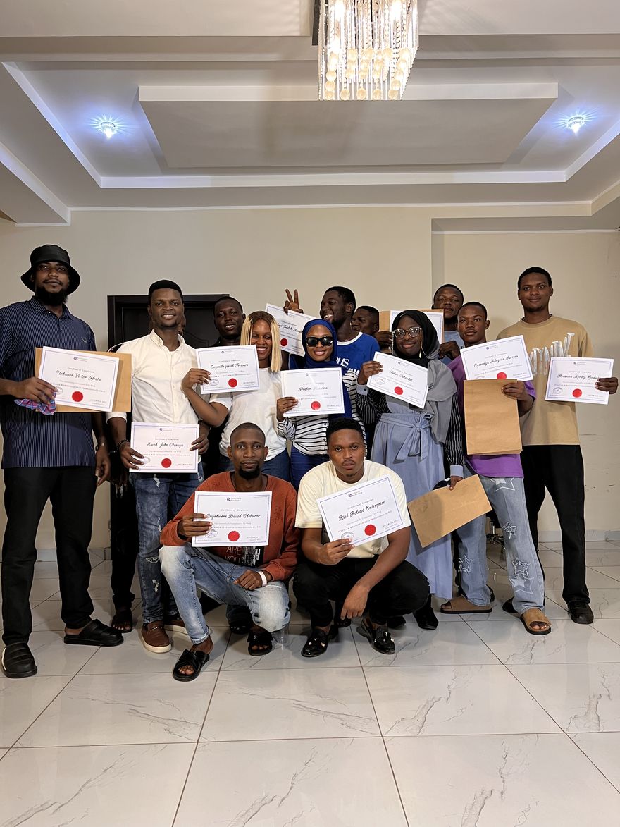 Tech Studio Academy graduates posing with their certificates of completion